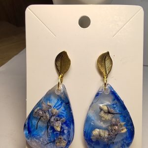 Boucle D'Oreille de Fleur Séché Fond bleu